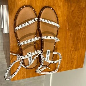Great condition (never worn) steve madden white sandals with silver spikes.